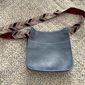 Stylish Blue Crossbody Bag with Patterned Strap